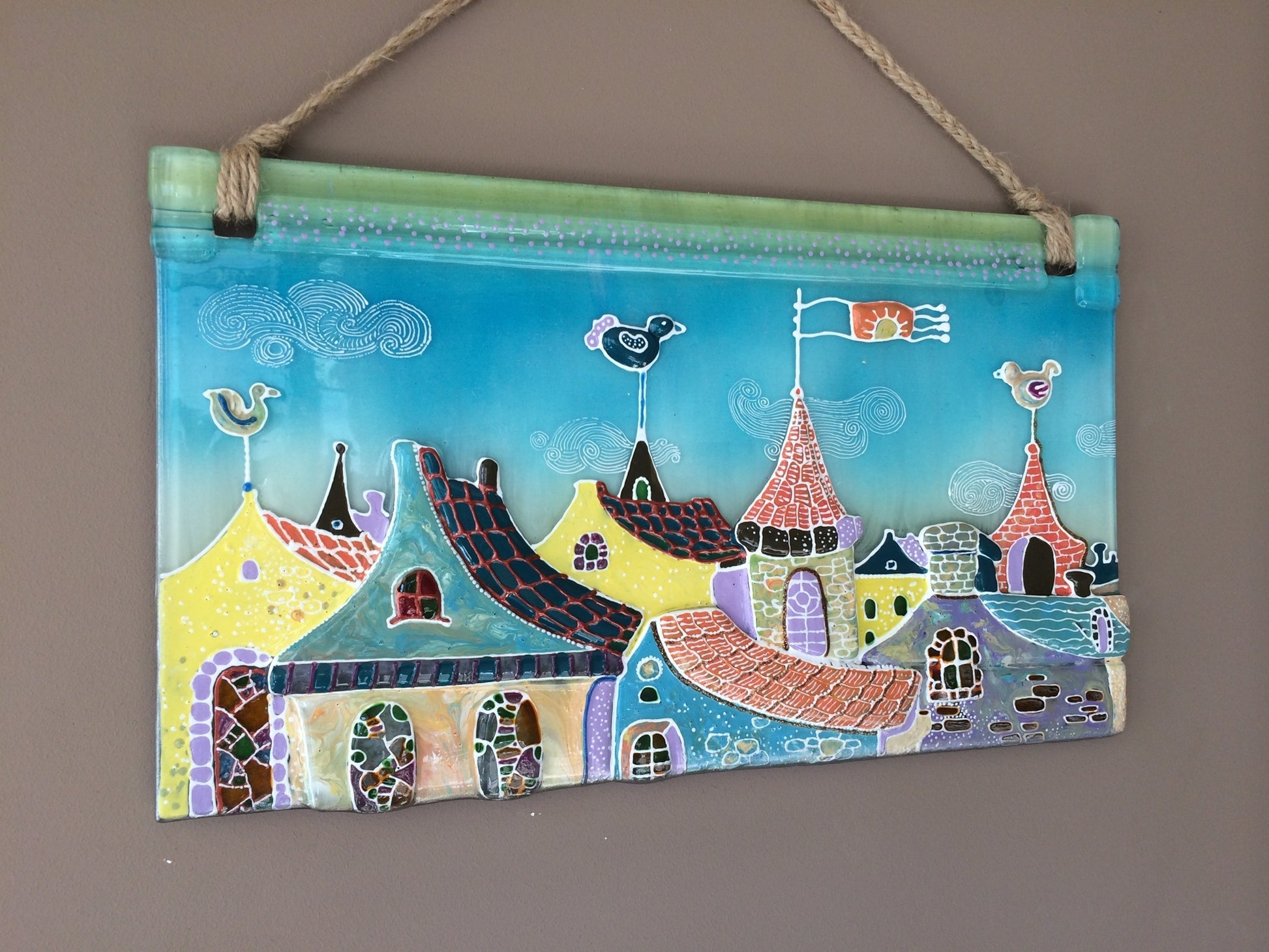 Walk in the Clouds City Roofs Glass Panel Wall Art - Hand-Painted Fused-Glass Panel with Whimsical Weather Vanes, 49 cm
